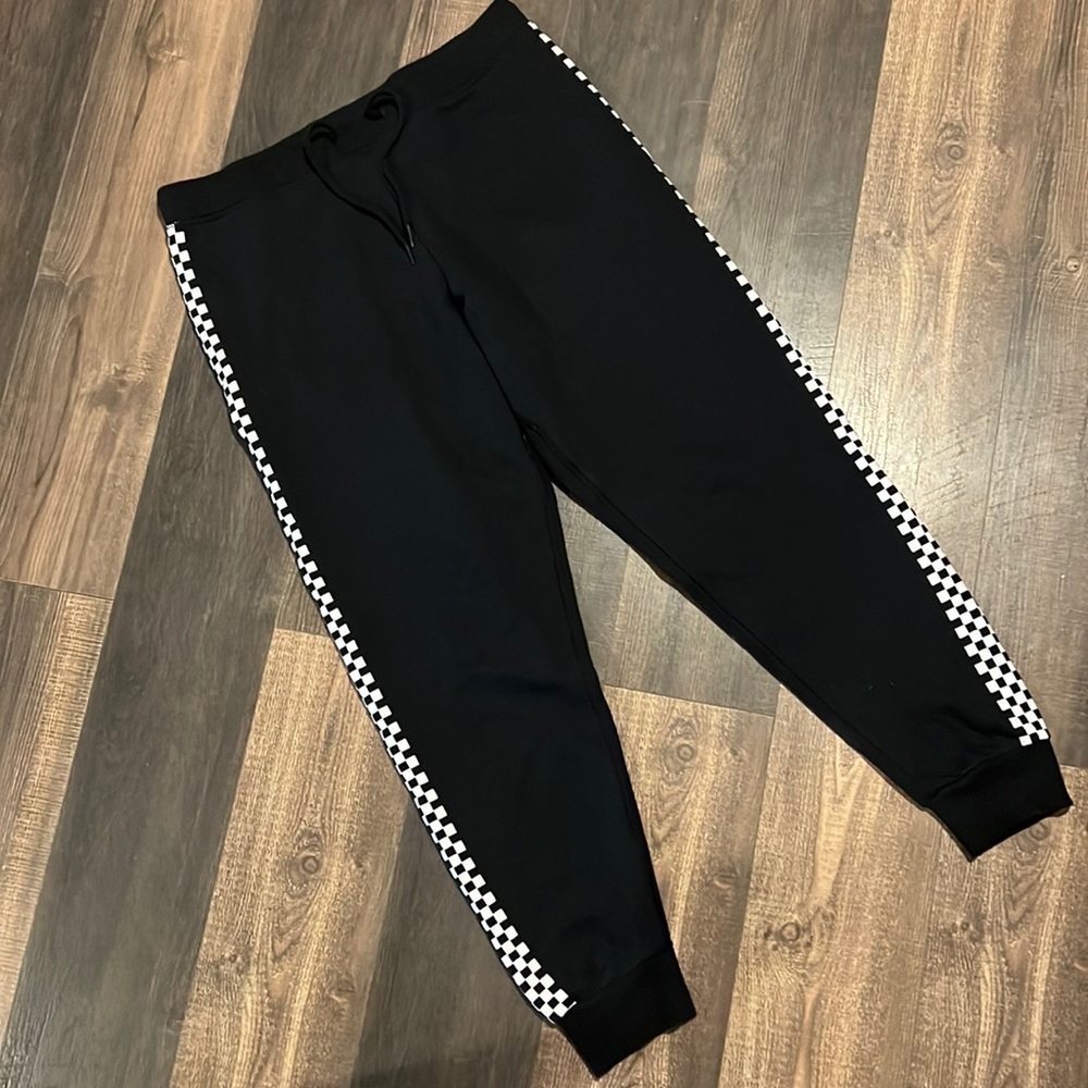 Vans Black Joggers with Vans Logo stripes on sides. Size M